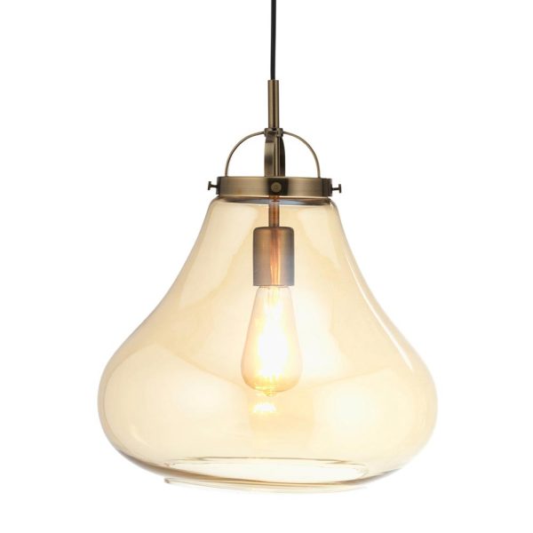 Turua large pendant light in antique brass with amber glass on white background lit