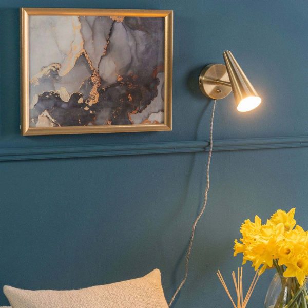 Cone plug in wall light bedside reading lamp in antique brass on bedside wall lit
