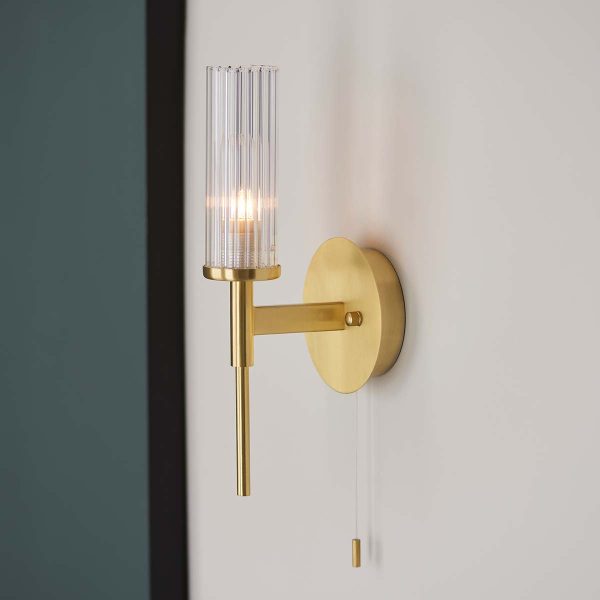 Endon Talo single switched bathroom wall light in satin brass on bathroom wall viewed from the side