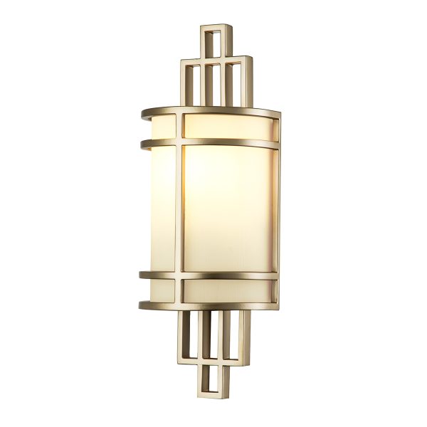 Feiss Fusion 1 light wall light in painted natural brass on white background, lit.