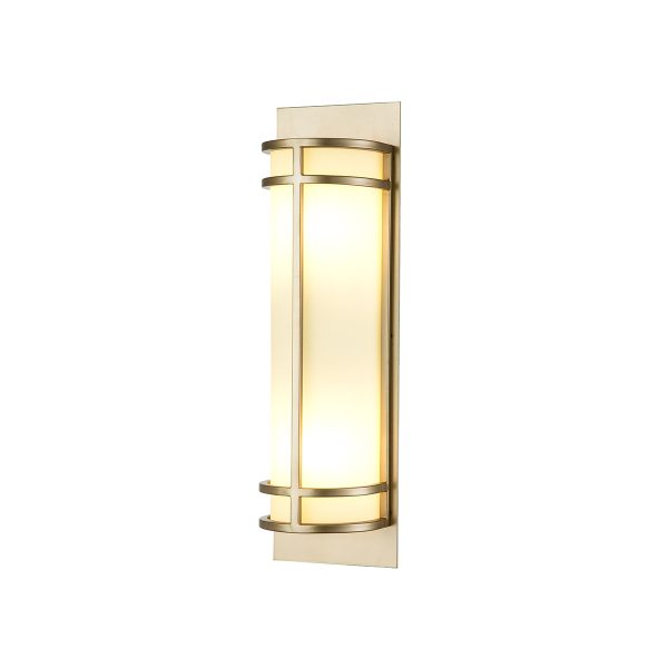 Feiss Fusion 2 light wall light in painted natural brass on white background, lit.