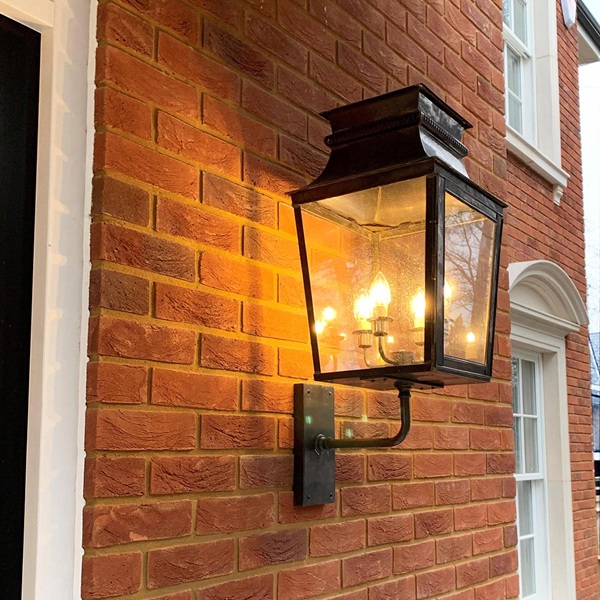 Large dark antique French period lantern fitted to outside wall