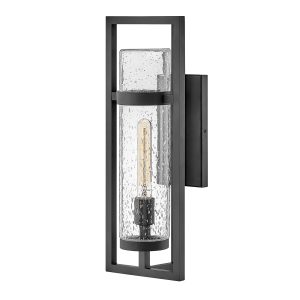 Cordillera 1 light modern outdoor wall light in matte black on white background, lit