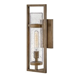 Cordillera 1 light modern outdoor wall light in burnished bronze on white background, lit