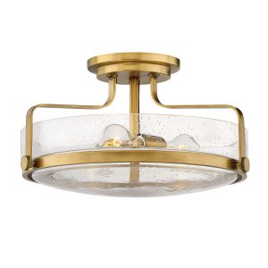 Hinkley Harper medium semi flush light in heritage brass with clear seeded glass on white background