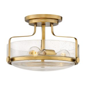 Hinkley Harper small semi flush light in heritage brass with clear seeded glass on white background