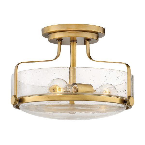 Hinkley Harper small semi flush light in heritage brass with clear seeded glass on white background