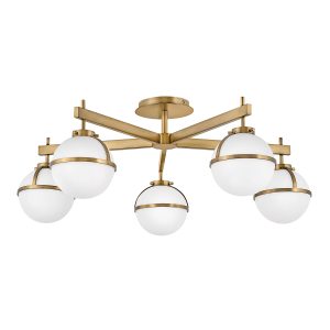 Hinkley Hollis large 5 light bathroom semi flush in heritage brass with opal glass shades on white background.