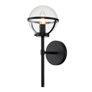 Hinkley Hollis 1 light bathroom wall light in black with seeded glass shade on white background, lit.