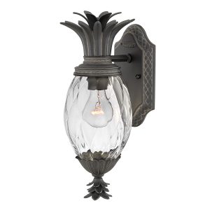 Plantation 1 Light small outdoor wall lantern in museum black on white background, lit