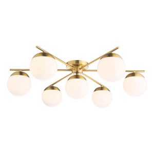 Bombazine 7 light semi flush ceiling light in natural solid brass on white background lit