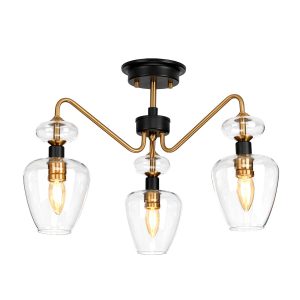 Armand 3 light semi flush ceiling light in aged brass and charcoal black on white background lit