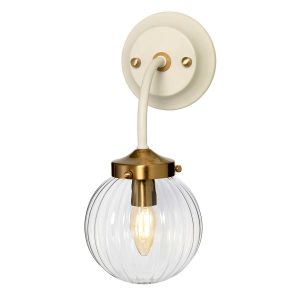 Elstead Cosmos single wall light in cream and aged brass on white background, lit.