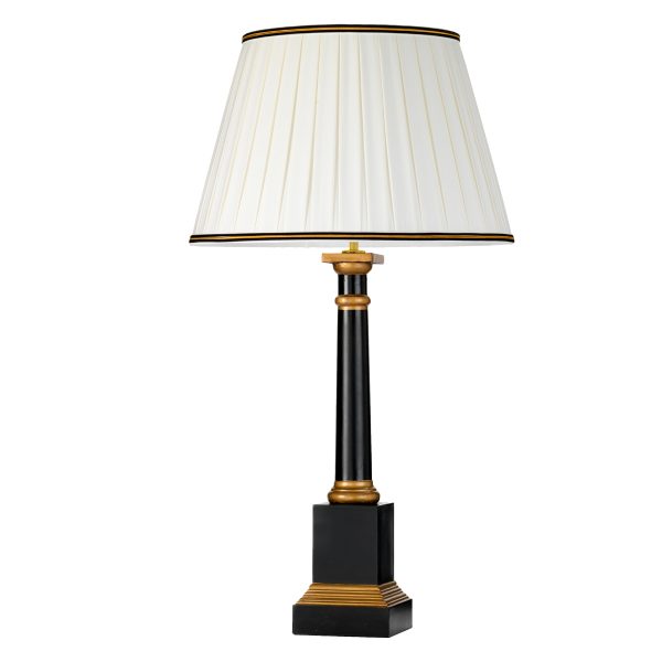 Peronne black and gold wood table lamp with ivory shade on white background.