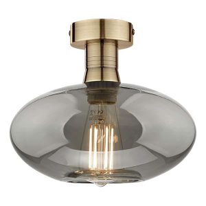 Emerson low ceiling light in antique brass with smoked oval glass shade on white background