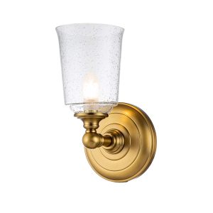 Huguenot Lake single bathroom wall light in burnished brass finish on white background, lit.