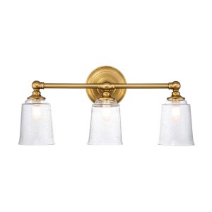 Feiss Huguenot Lake triple bathroom mirror light in burnished brass on white background, lit.