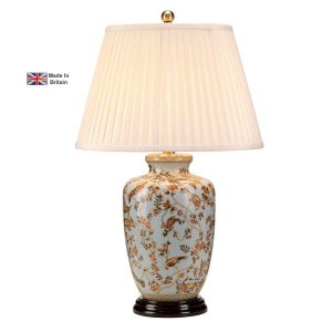 Gold Birds British made porcelain table lamp with cream shade on white background lit