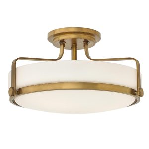 Hinkley Harper 3 light medium semi flush light in heritage brass with opal glass on white background