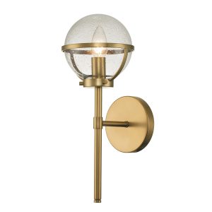 Hinkley Hollis 1 light bathroom wall light in heritage brass with seeded glass on white background, lit.