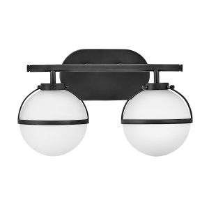 Hinkley Hollis 2 light bathroom wall light in black with opal glass shades on white background.