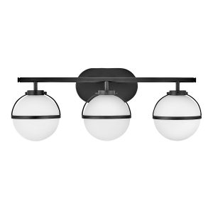 Hinkley Hollis 3 light bathroom mirror light in black with opal glass shades on white background.