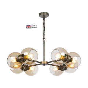 Juno 8 light ceiling pendant in solid brass on white background lit