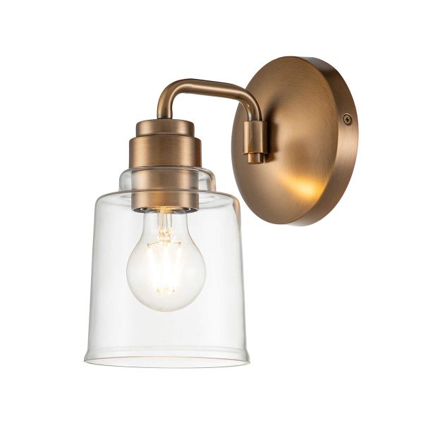 Kichler Aivian single wall light in weathered brass on white background, lit.