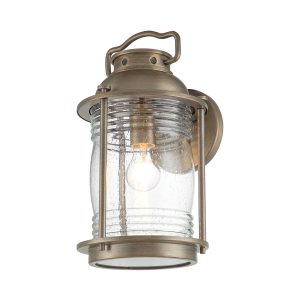 Kichler Ashland Bay 1 light large outdoor wall lantern in burnished bronze on white background, lit.