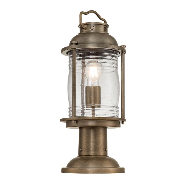 Kichler Ashland Bay 1 light outdoor pedestal lantern in burnished bronze on white background, lit.