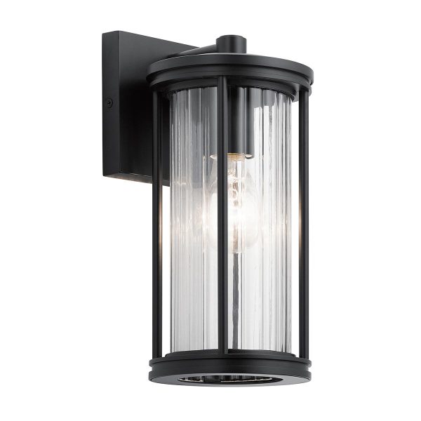 Kichler Barras small outdoor wall lantern in black with ribbed glass shade on white background