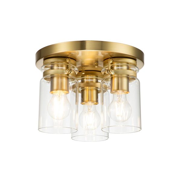 Kichler Brinley 3 light flush in brushed brass finish on white background, lit.