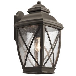 Kichler Tangier large outdoor wall lantern in olde bronze on white background, lit.