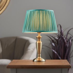 Oslo small traditional table lamp in antique brass fir silk shade roomset