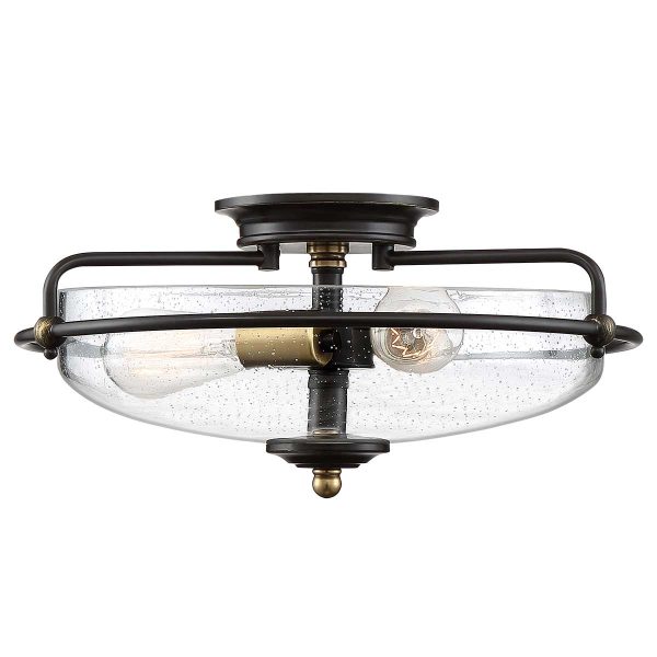 Quoizel Griffin 3 light flush ceiling light in Palladian bronze with weathered brass accents and seeded glass on white background