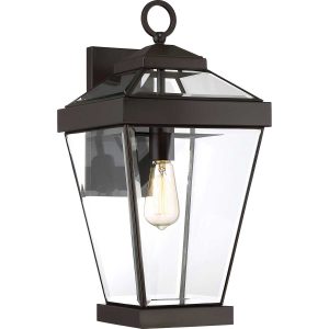 Ravine classic large outdoor wall lantern in western bronze on white background, lit