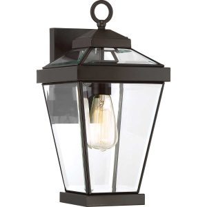 Quoizel Ravine classic medium outdoor wall lantern in western bronze on white background, lit