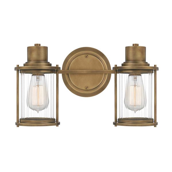 Quoizel Riggs twin bathroom wall light in weathered brass on white background