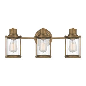 Quoizel Riggs 3 light bathroom wall light in weathered brass on white background