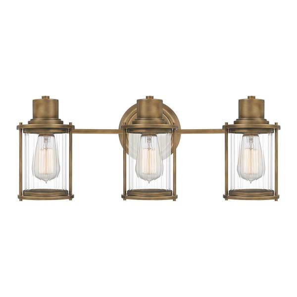 Quoizel Riggs 3 light bathroom wall light in weathered brass on white background