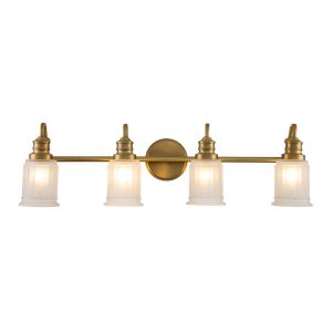 Quoizel Swell 4 light bathroom wall light in brushed brass on white background lit